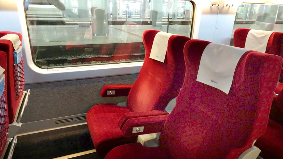 First Class carriage on a Seoul to Busan train, wide 2-plus-1 leather seats with extra legroom